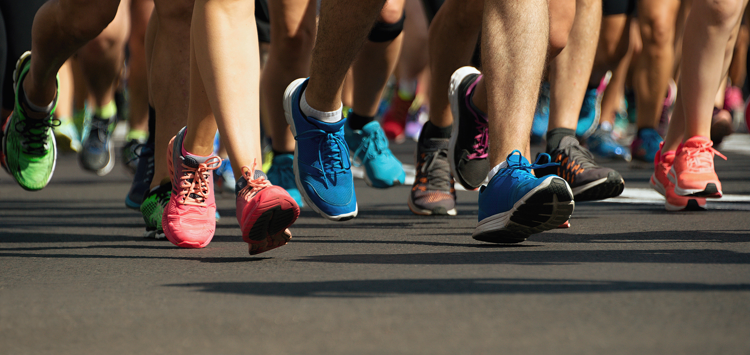 Marathon runners running on city road