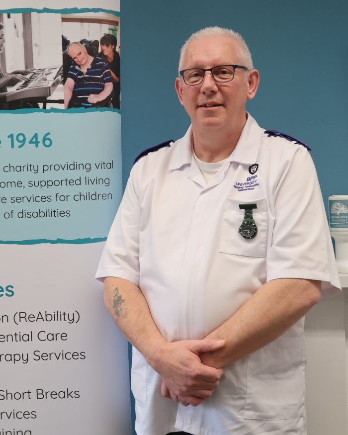 Ken in his nurses uniform