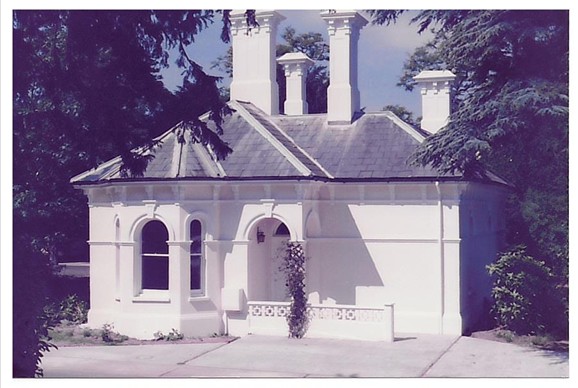 White building with tall chimneys