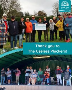 Band members holding cheque